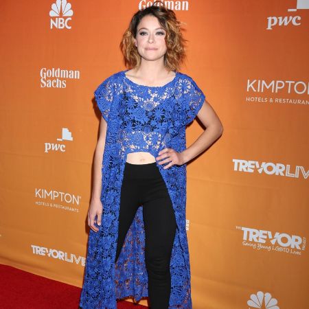 Tatiana Maslany wears a blue outfit for an event